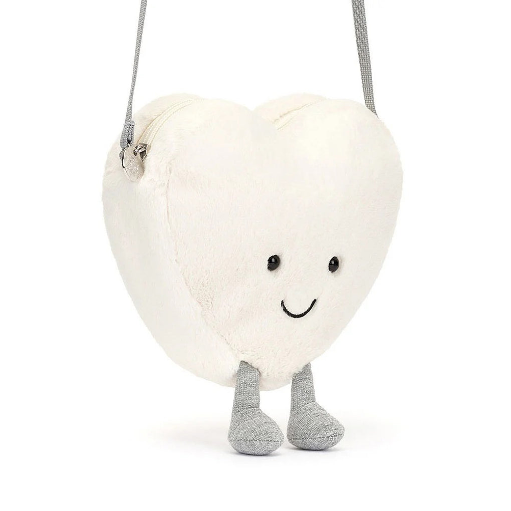 Amuseables Cream Heart Bag being held.