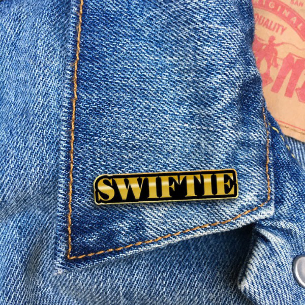 Swiftie Enamel Pin on jacket.