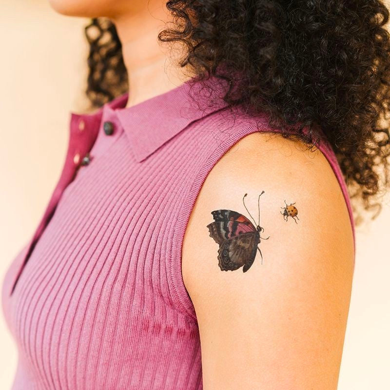 Beetle & Butterfly Tattoo Set of Two person wearing.