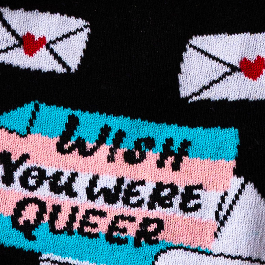 Close-up view of Wish You Were Queer Unisex Crew Socks.