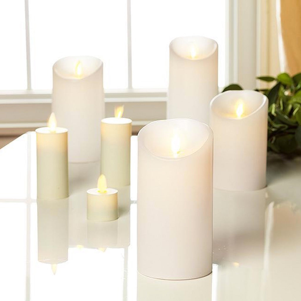 Ivory Reallite Candles in a group.