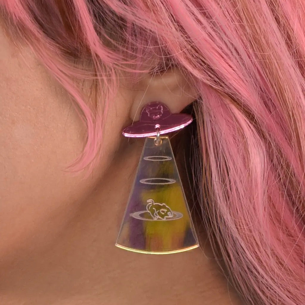 Person wearing Cat From Meow-ter Space Earrings.