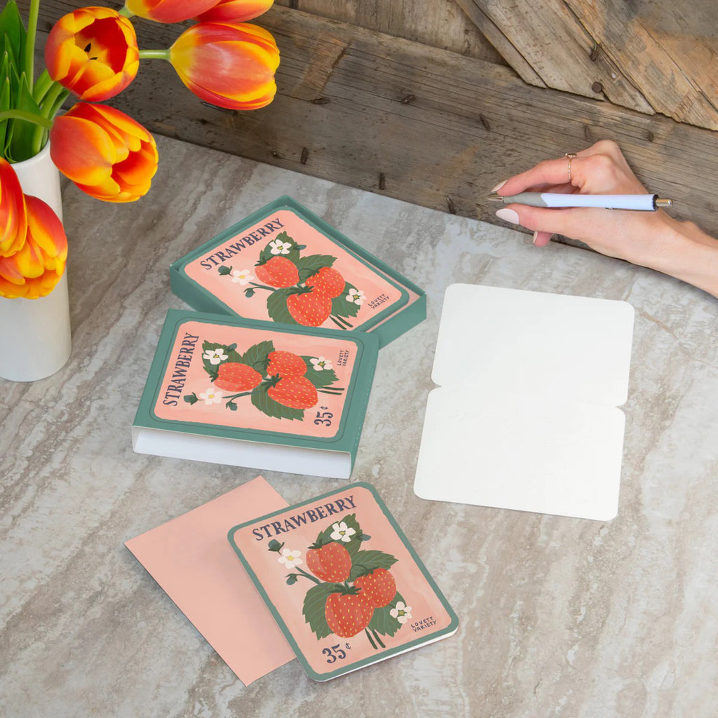 Strawberry Seeds Artisan Note Card Set on table.