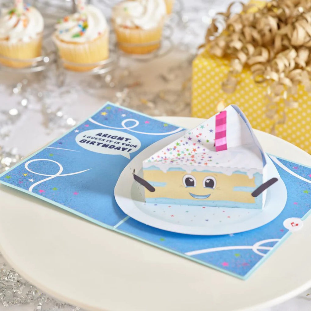 Whimsical Birthday Cake Slice Pop-Up Card on table.