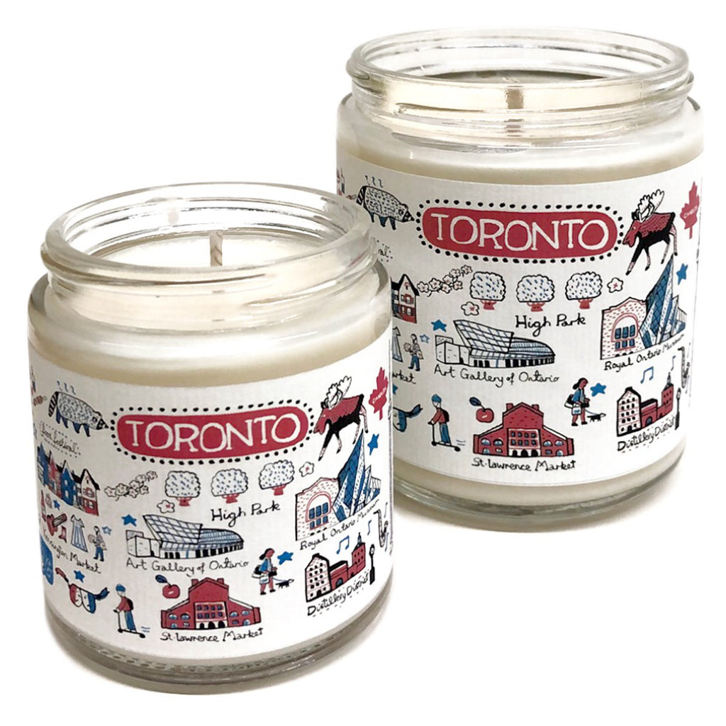 Two sizes of a Toronto candle showing the cityscape.