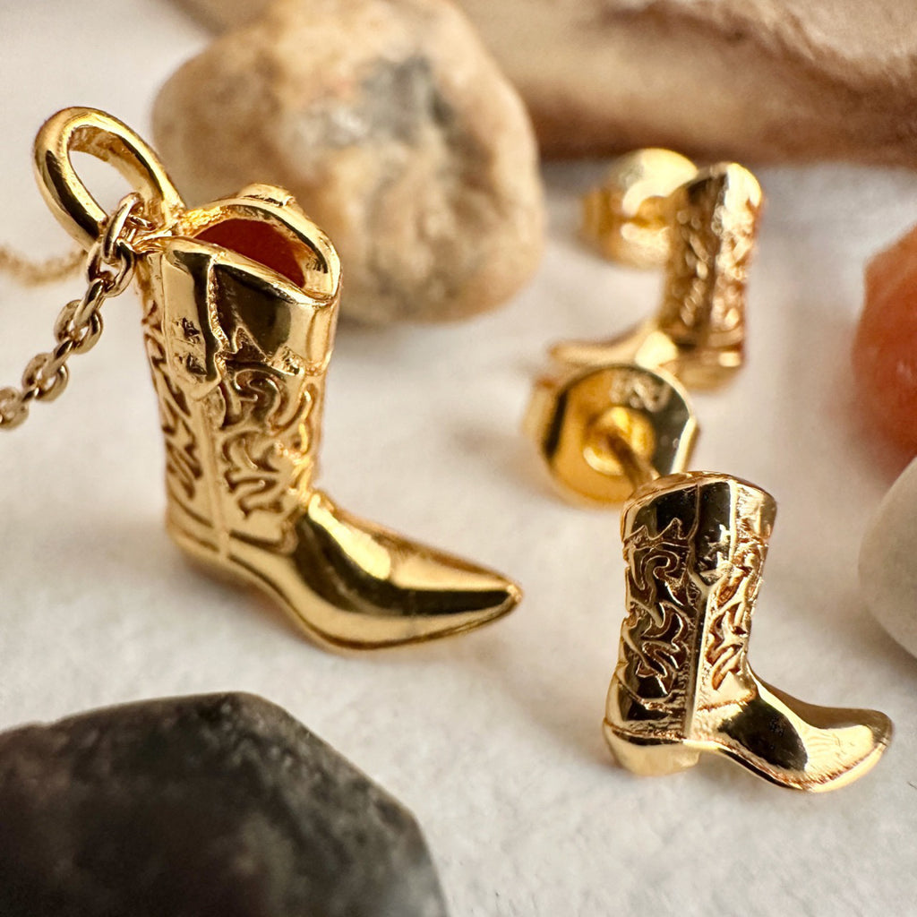 Angle view of Cowboy Boot Stud Earrings Gold.