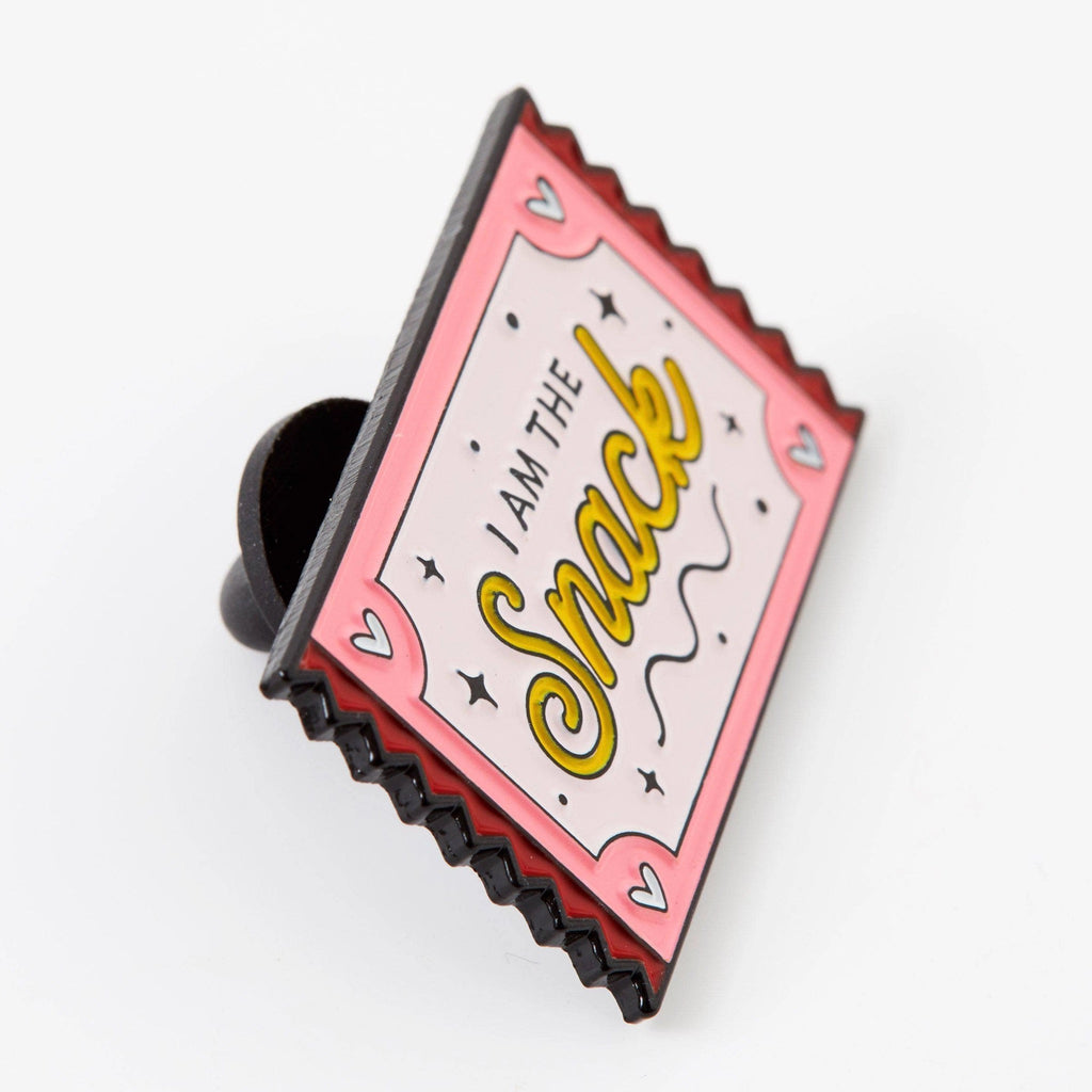 Angle view of I Am The Snack Enamel Pin.