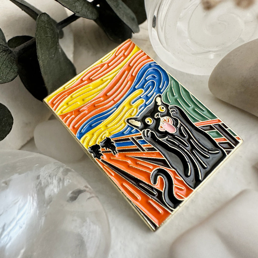 Angle view of The Scream Cat Enamel Pin.