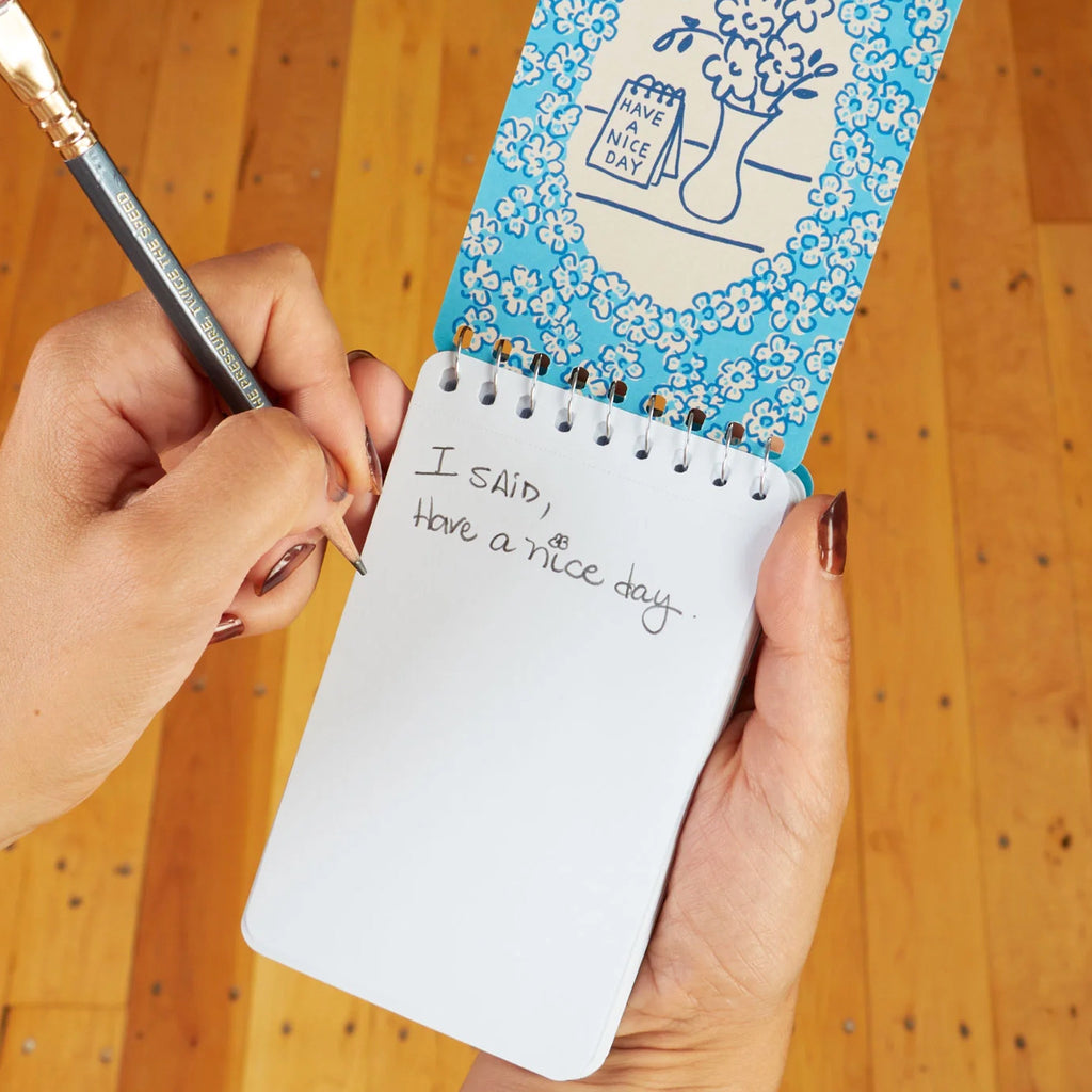 Angry Woman Essays Spiral Notebook being used.