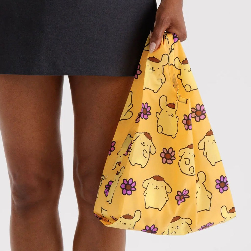 Baby Baggu Pompompurin in hand.