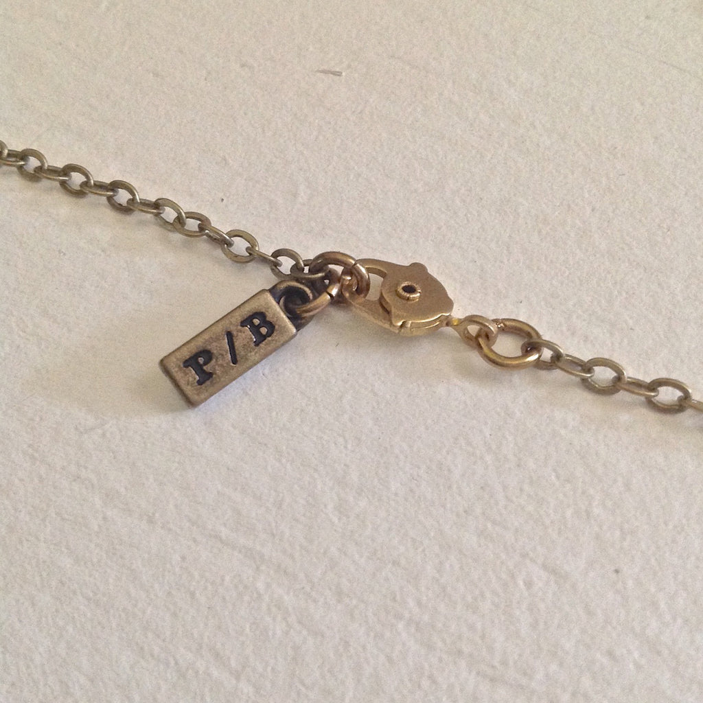 Back of Swan Harmonica Necklace.