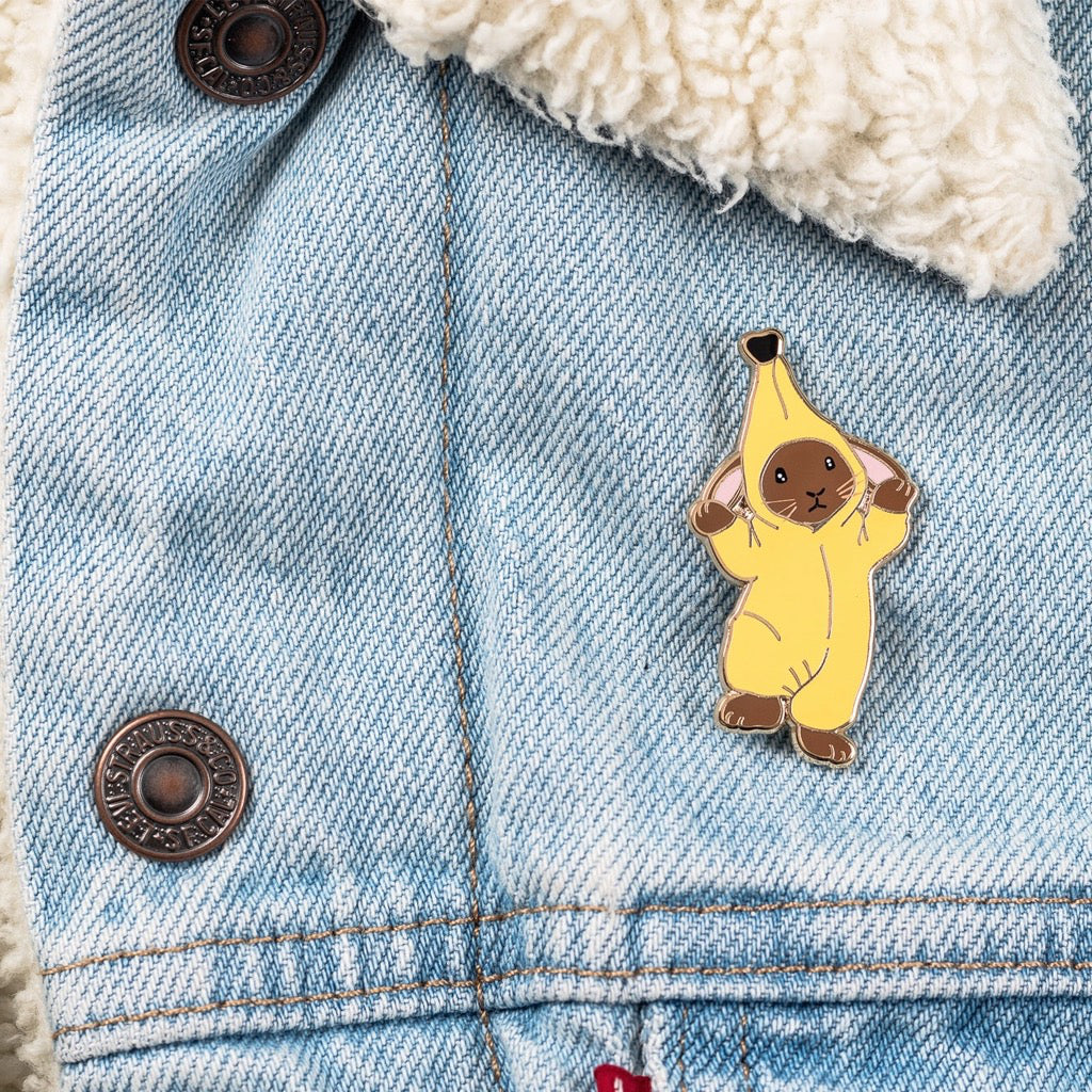 Banana Bunny Enamel Pin on jacket.