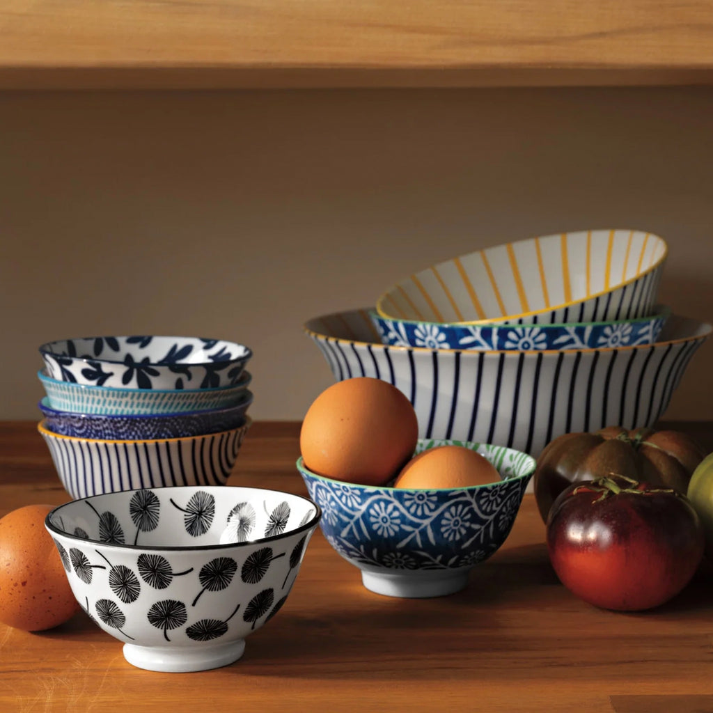 Blue Floral Stamped Bowl 3.5 Inch on table.