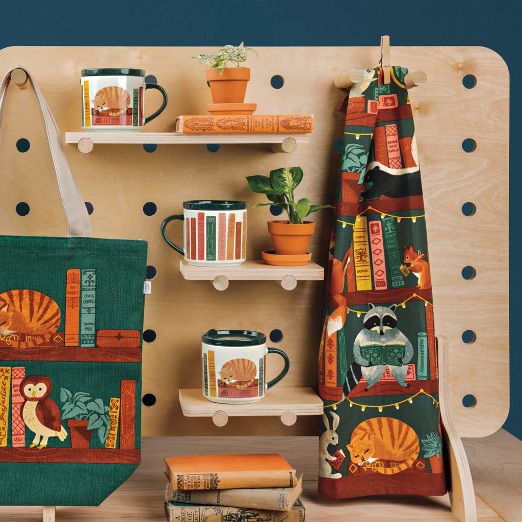 Book Club Mug with Lid on shelf.