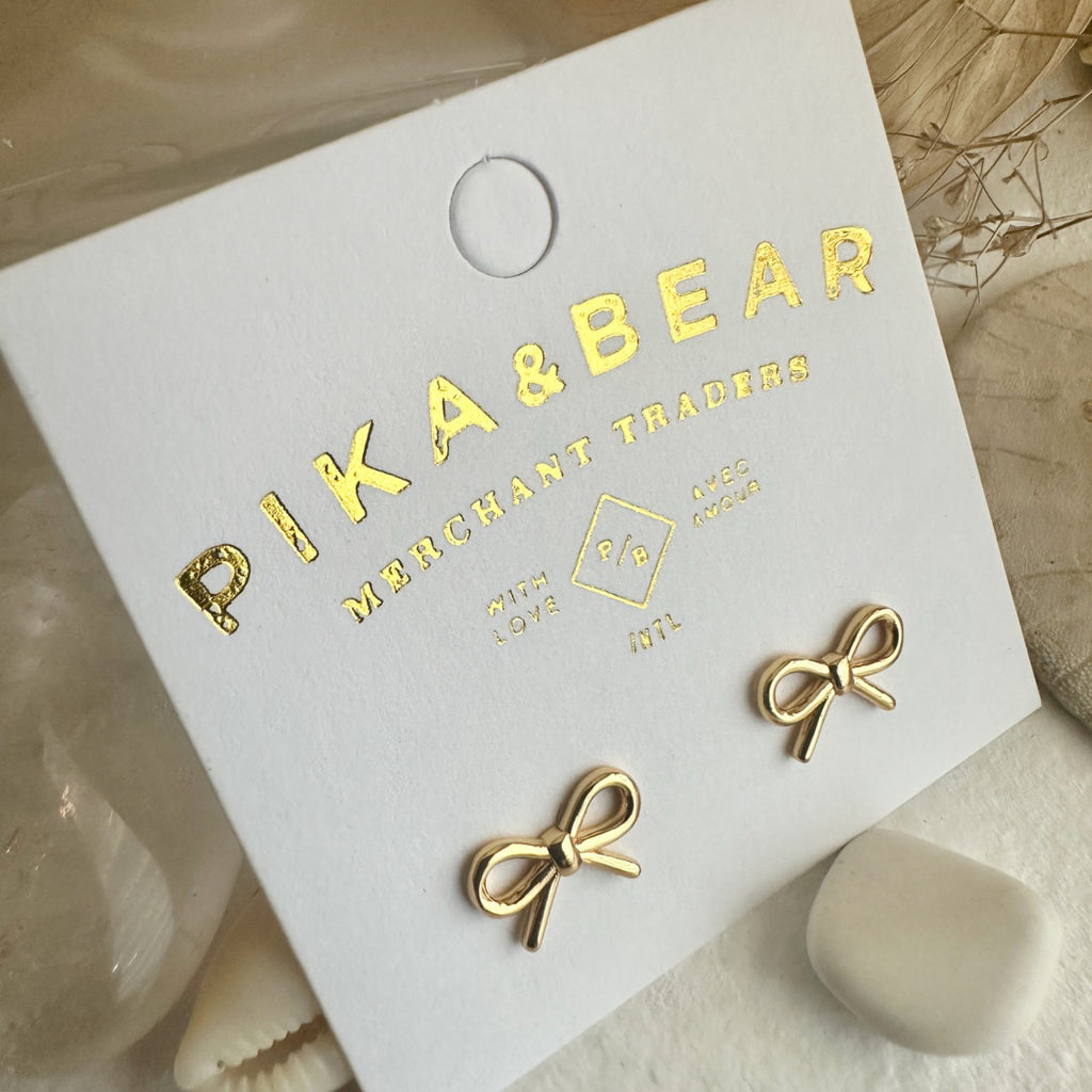Bow Stud Earrings Gold packaging.