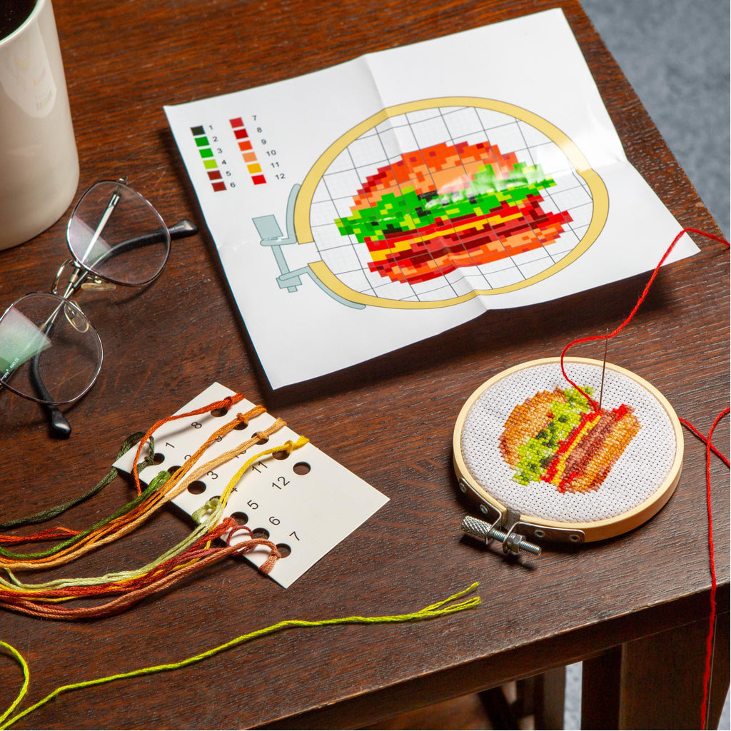 Burger Mini Cross Embroidery Kit on table.