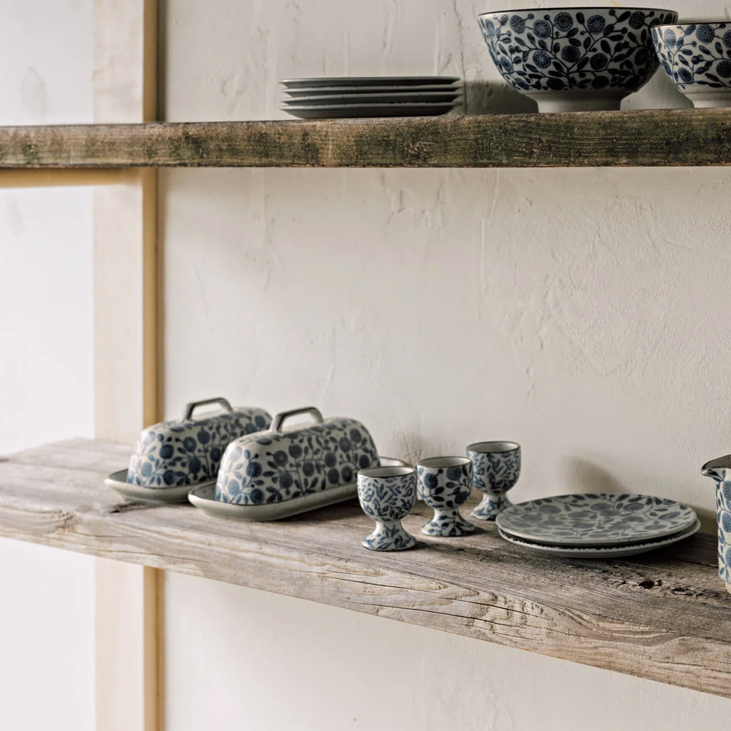 Calendula Element Butter Dish on shelf.