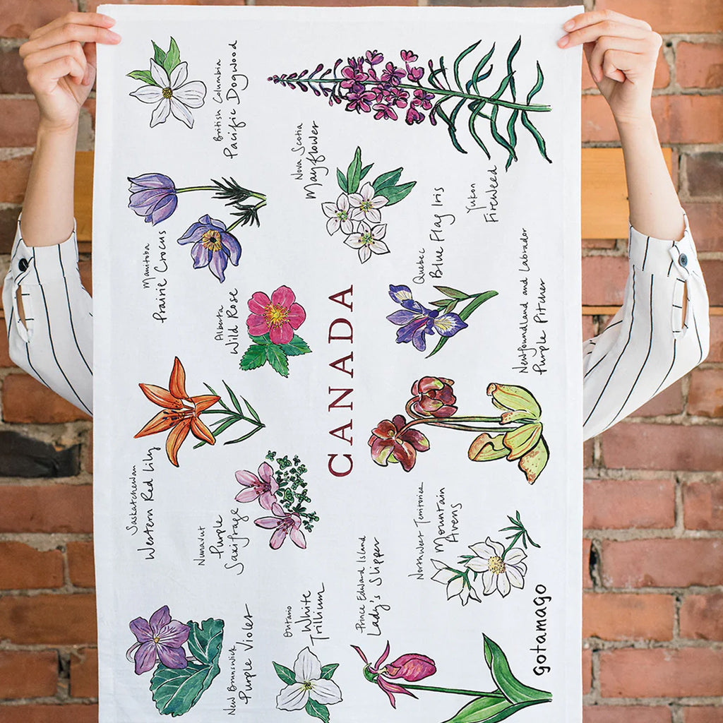 Canada Provincial Flowers Organic Tea Towel being held.