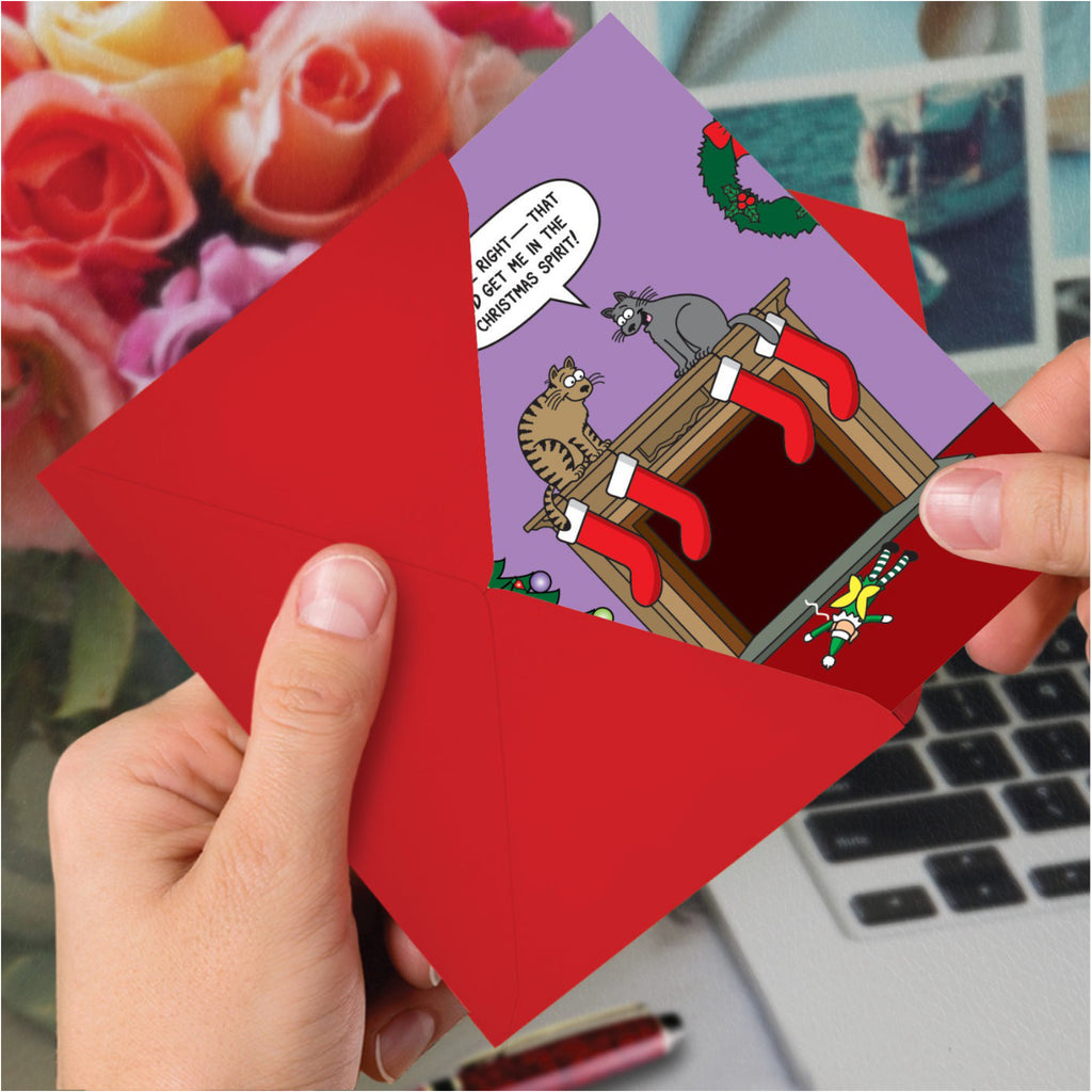 Cat Holiday Spirit Christmas Card in hand.