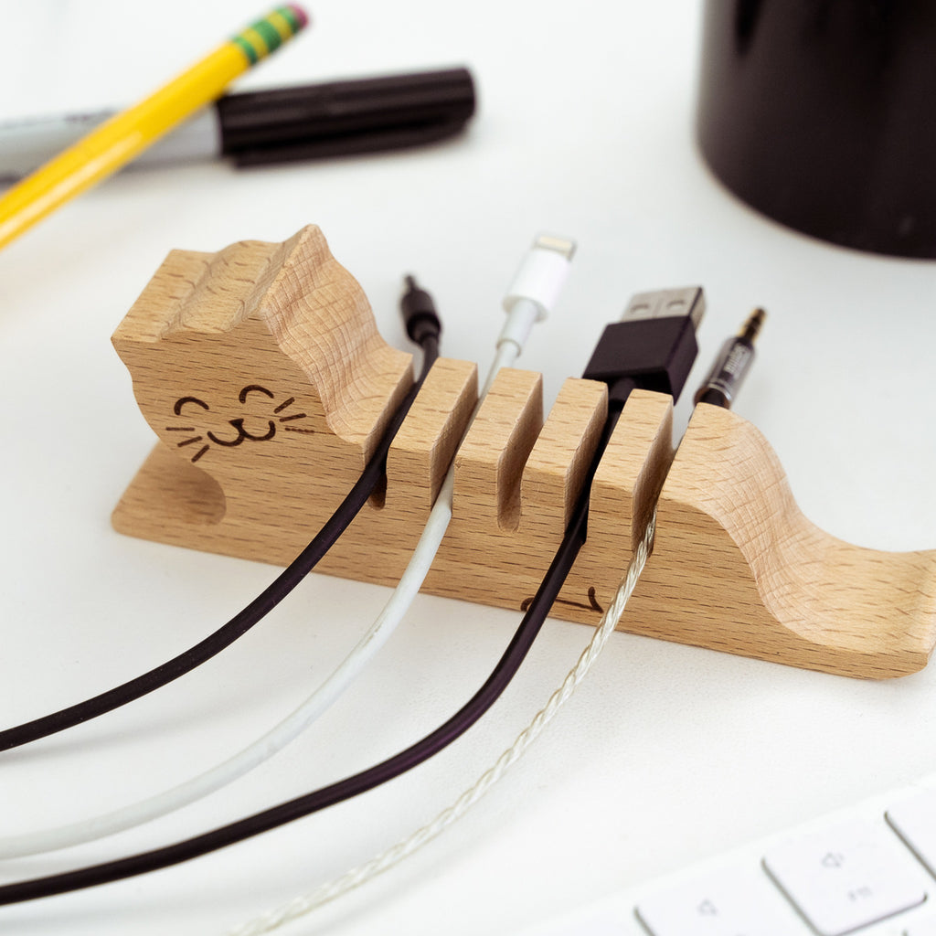 Cat Multi Cord Holder on table.