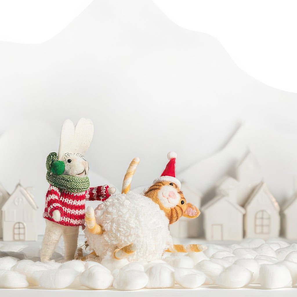 Cat Snowball Ornament on 'snow'.