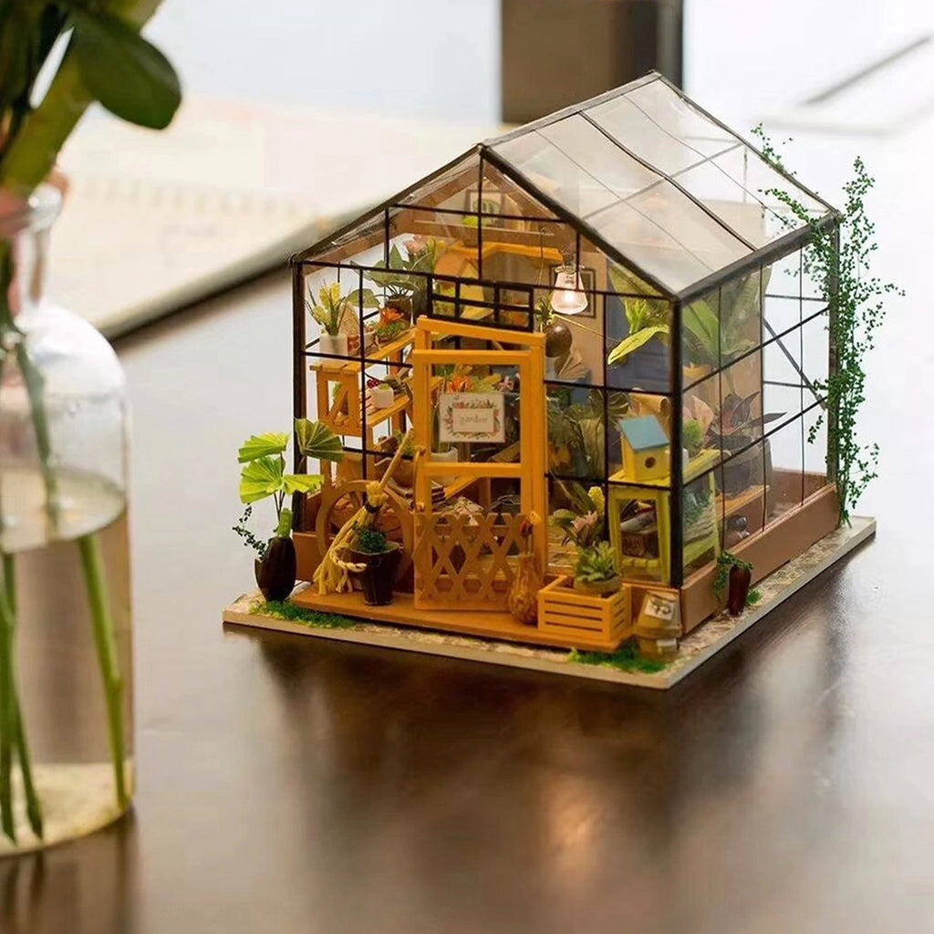 Cathy's Flower House DIY Miniature House Kit on table.