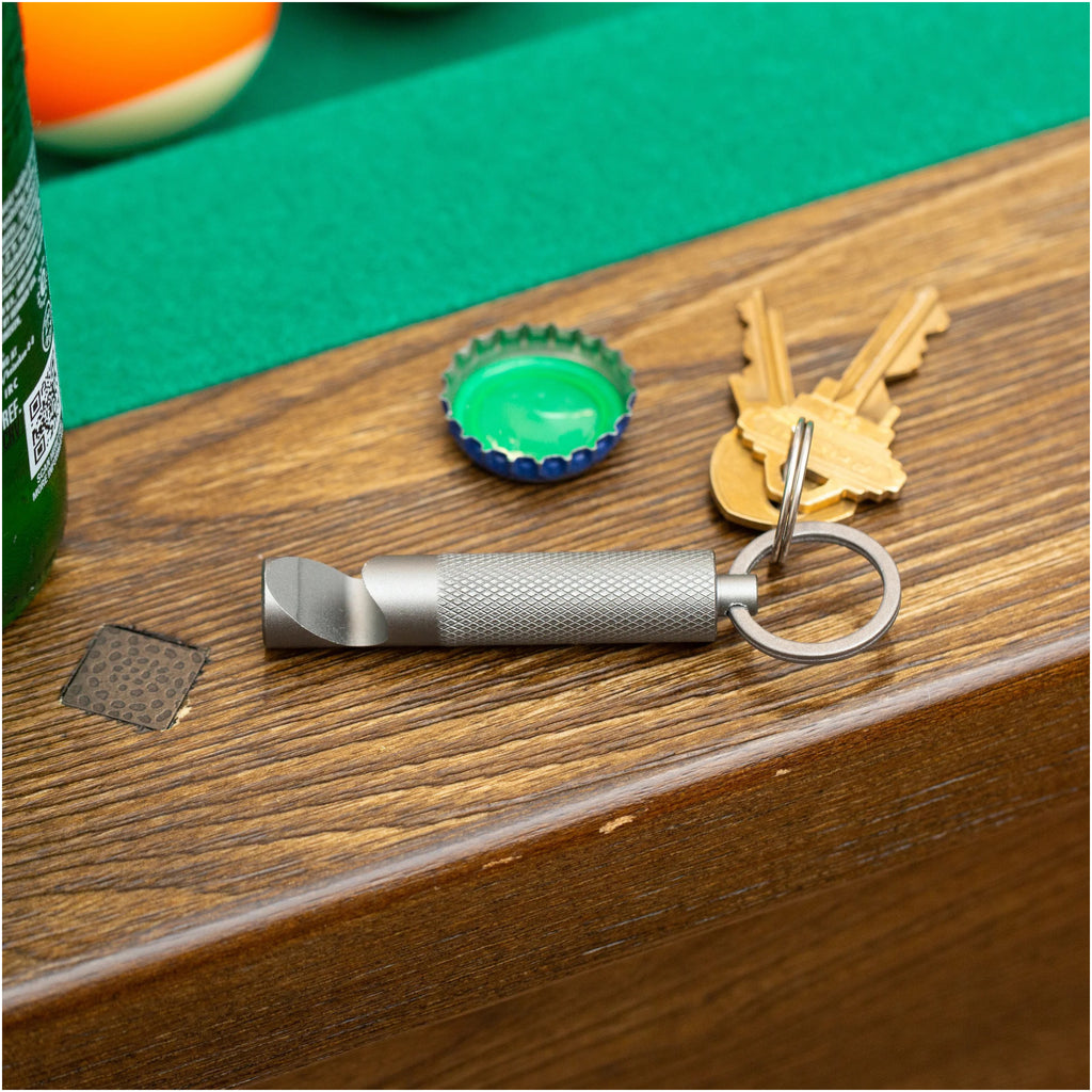 Chug It! Key Ring on table.