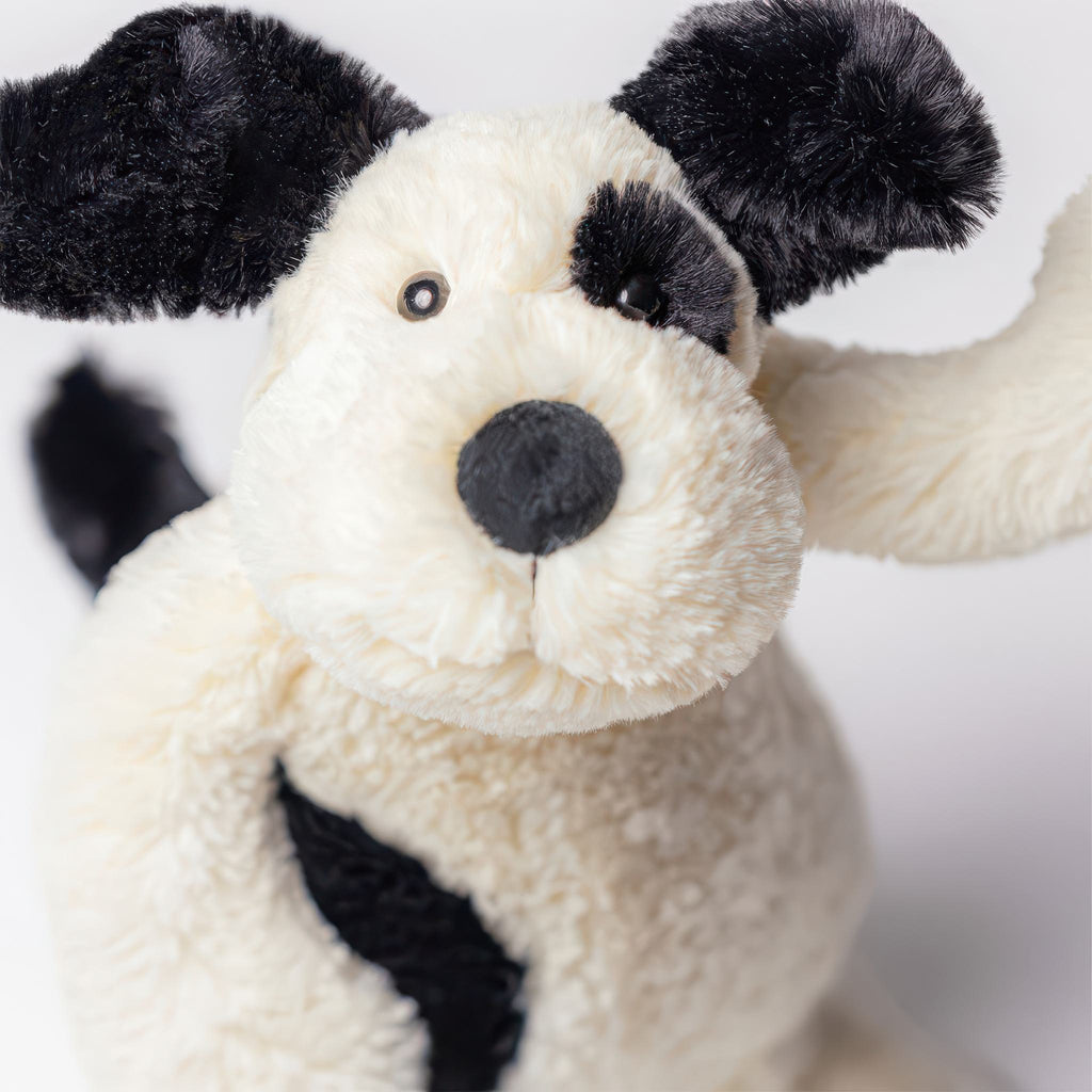 Close-up view of Bashful Black & Cream Puppy Original.