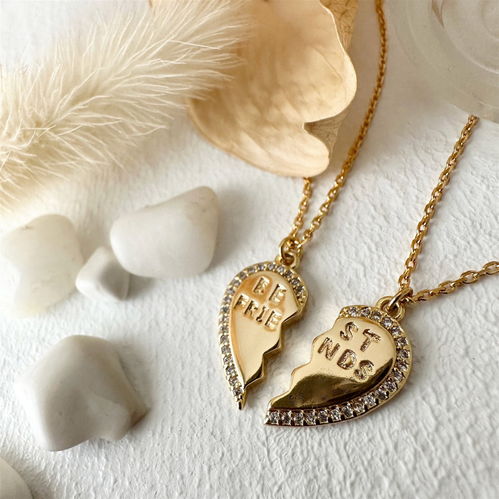 Close-up view of Best Friends Heart Charm Necklaces Gold.
