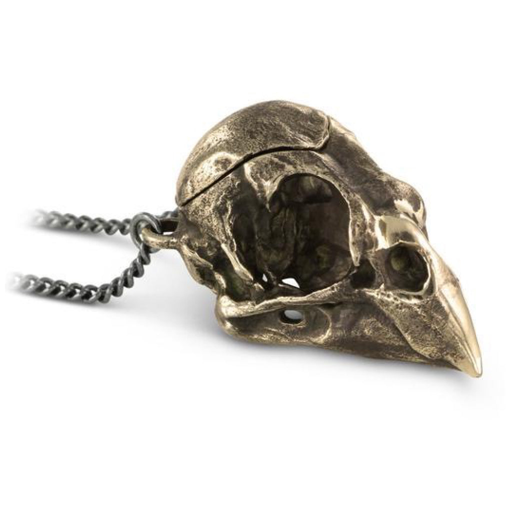 Close-up view of Cardinal Skull Locket Bronze.