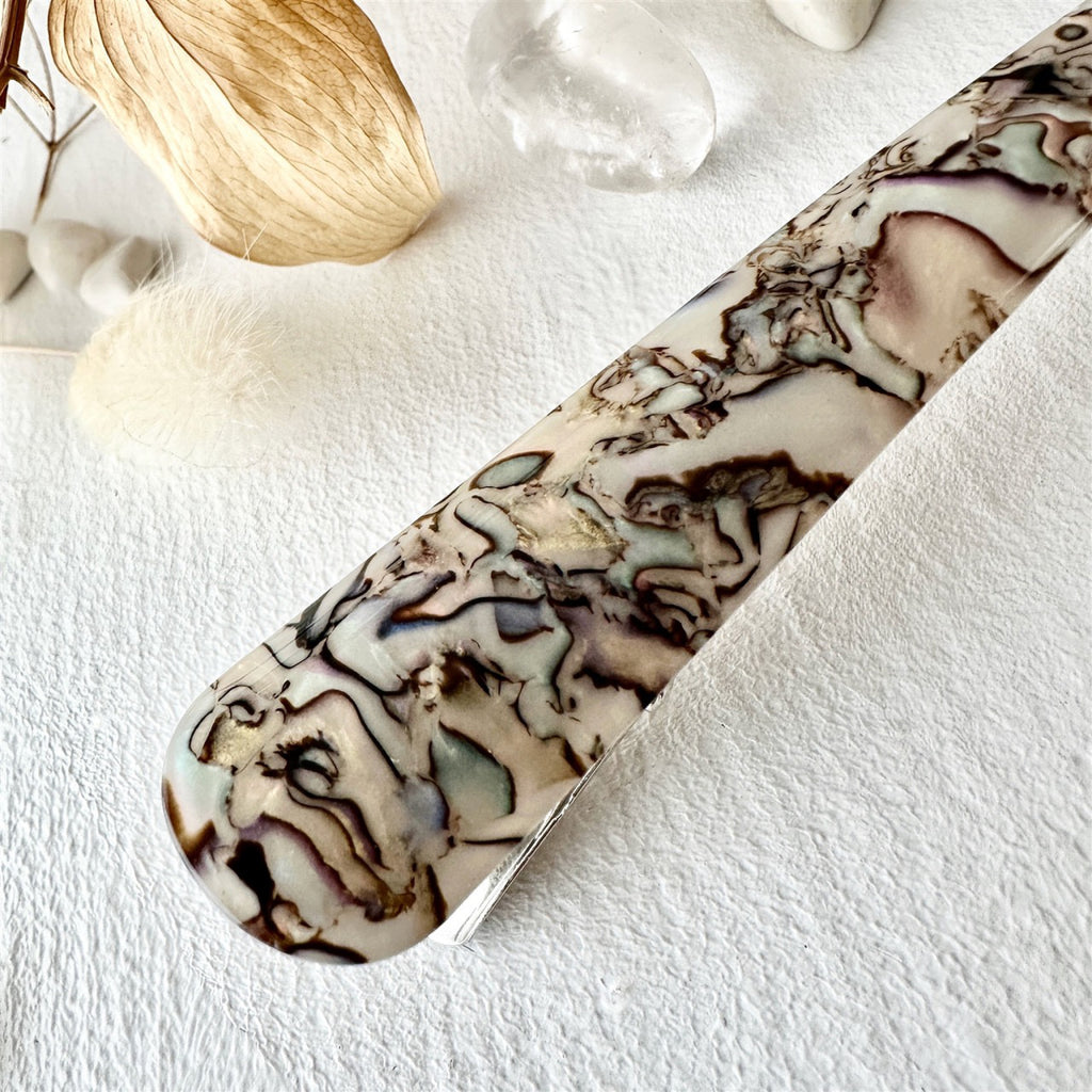 Close-up view of Extended Bird Beak Hair Clip White Shell.