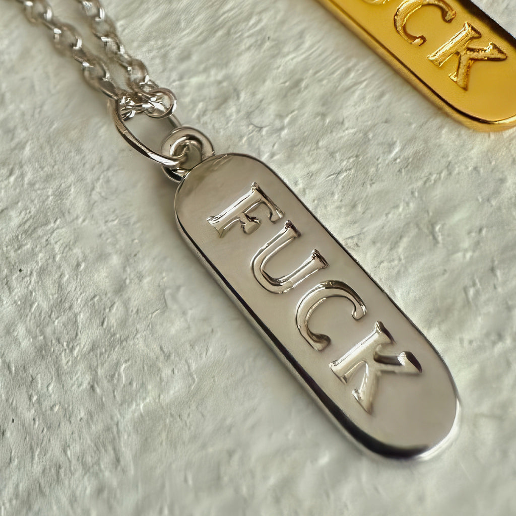 Close-up view of Salty Language Charm Necklace Silver.