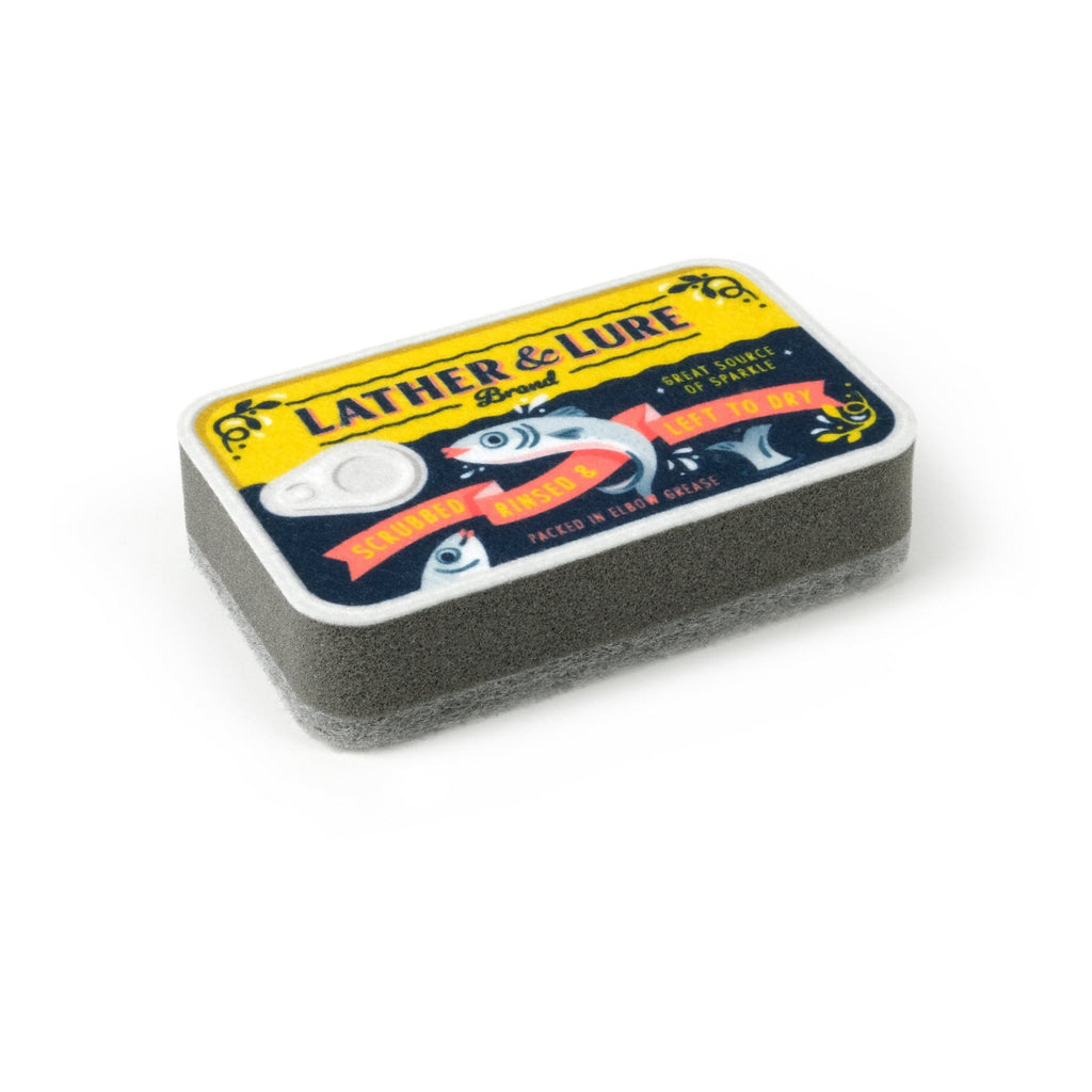 Close-up view of the yellow Tidy Tins Sardine Kitchen Sponge.