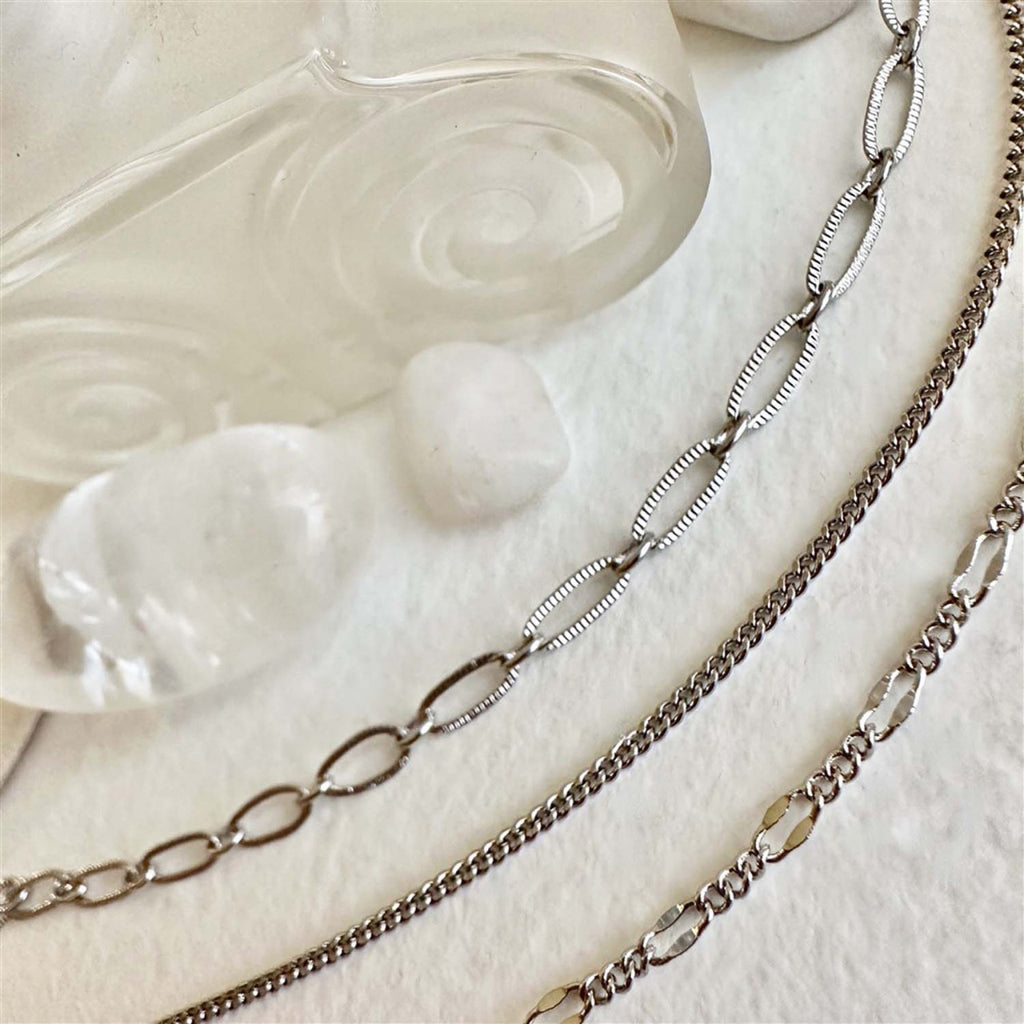 Close-up view of Triple Layer Textured Chain Necklace Silver.