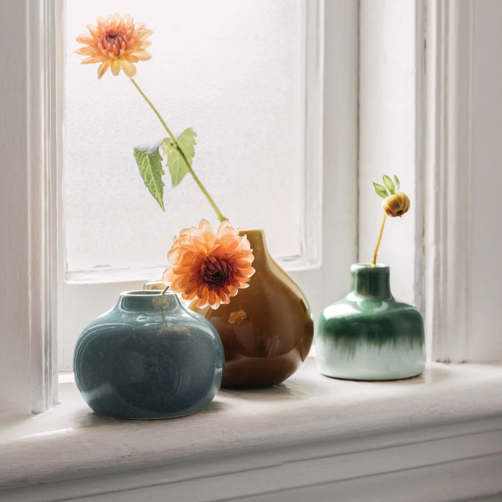 Cove Ceramic Bud Vase on window ledge.