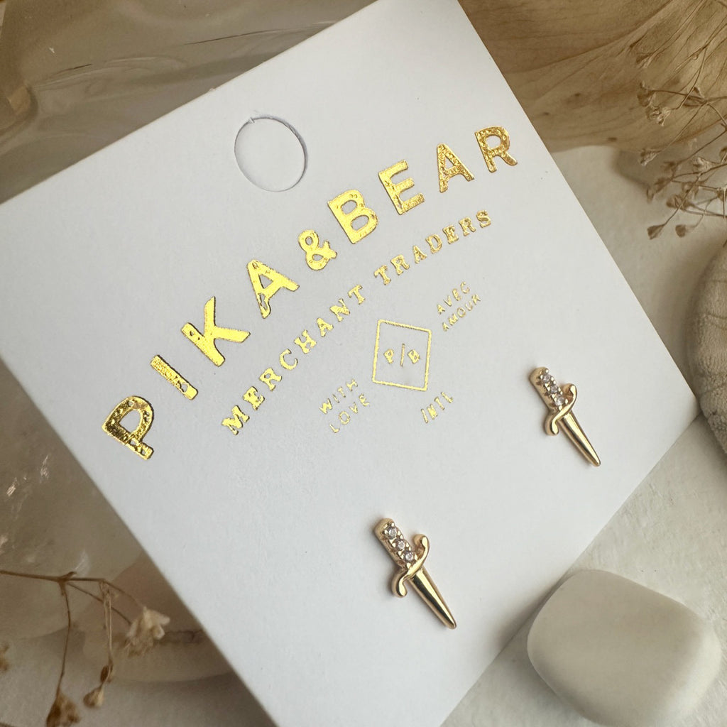 Dagger Stud Earrings Gold packaging.