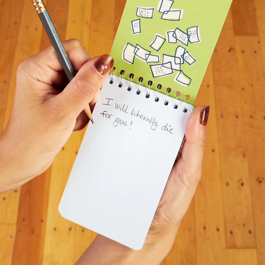 Deep Thoughts Spiral Notebook being used.