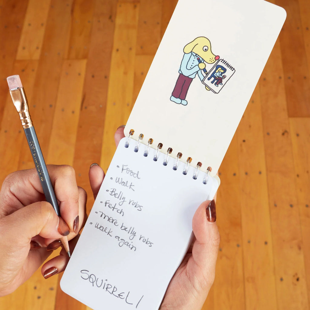 Diary Of A Dog Spiral Notebook being used.