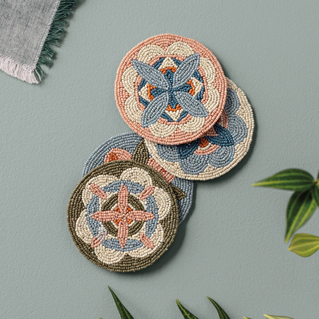 Disco Formation Beaded Coasters Set of 4 on table.