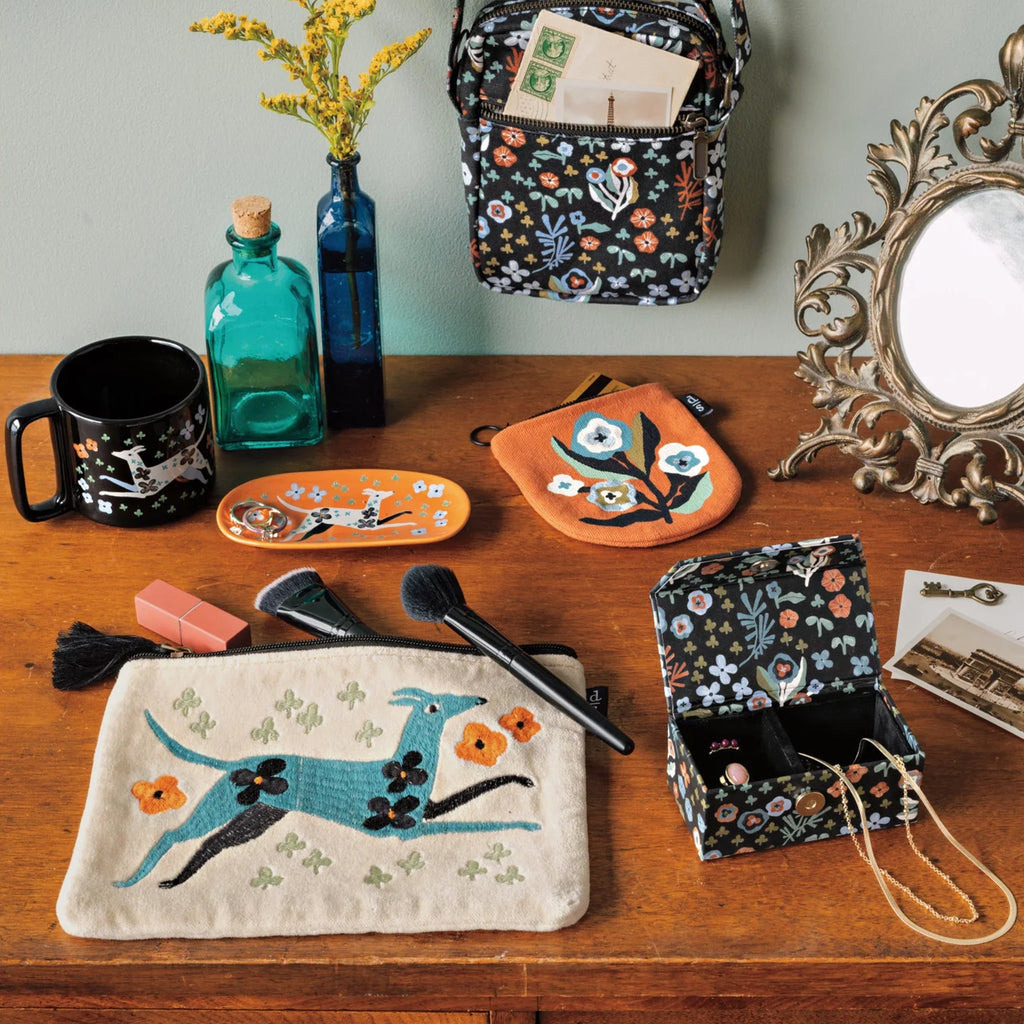 Dogwood Embroidered Flat Pouch on table.