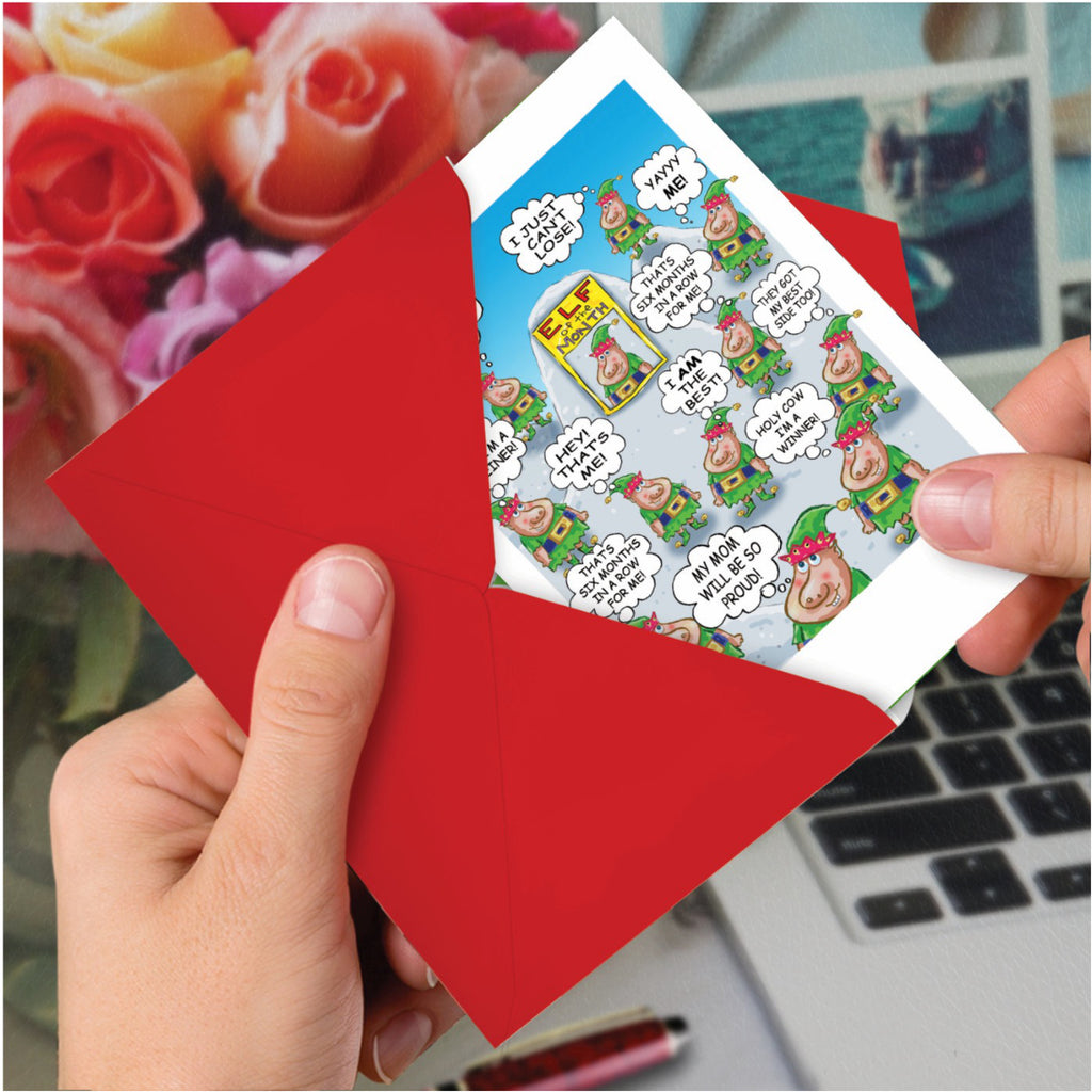 Elf Of The Month Christmas Card in hand.