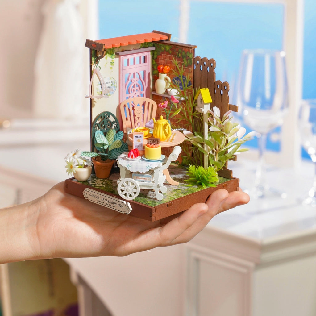 Fancy Tea Yard DIY Miniature House Kit in hand.