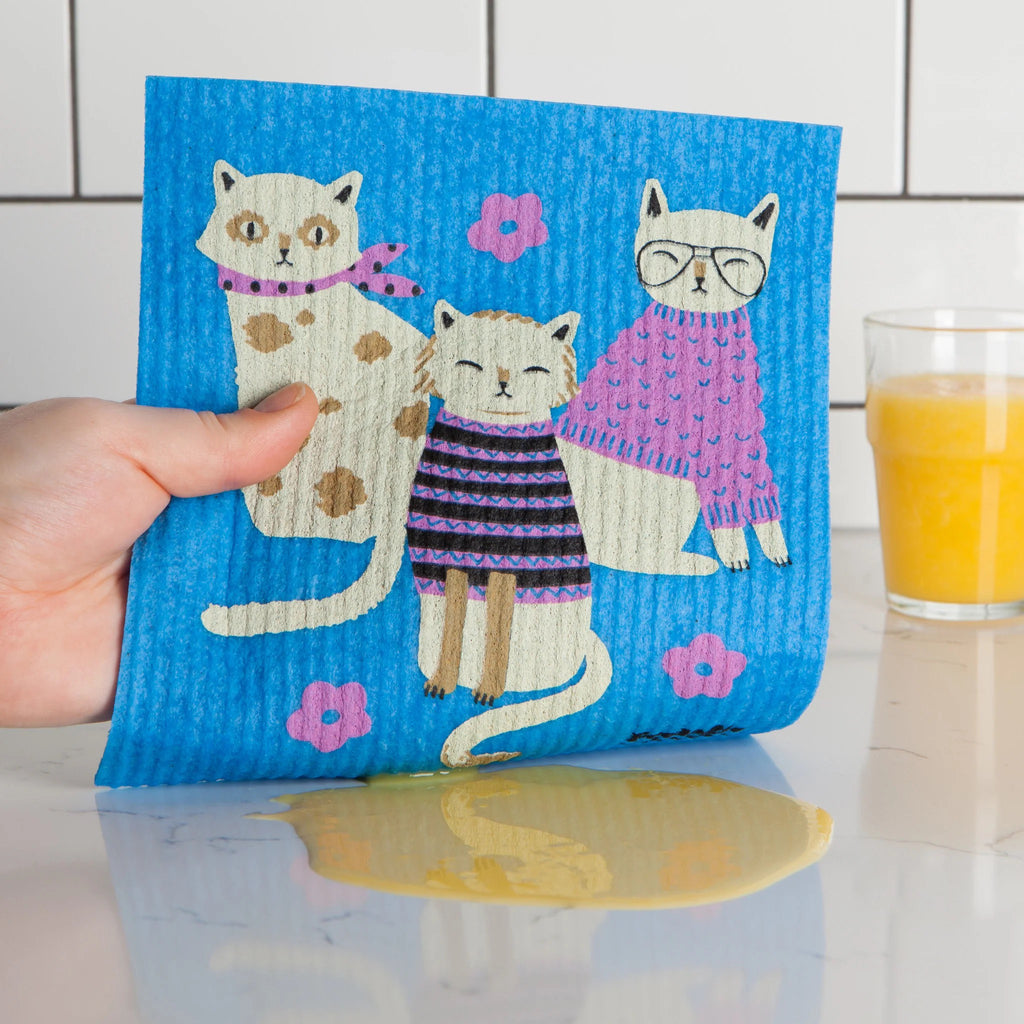 Feline Fine Swedish Sponge Cloth in hand.