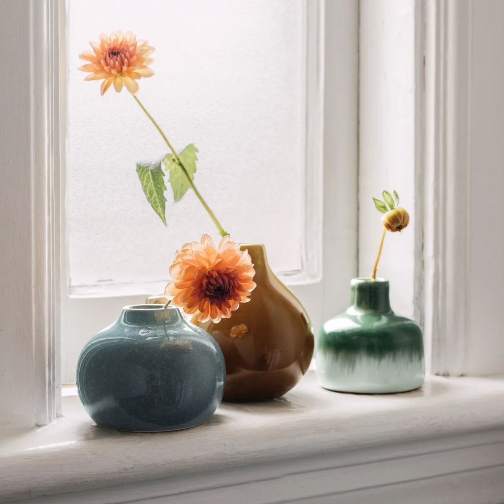 Fir Ceramic Bud Vase on window ledge.