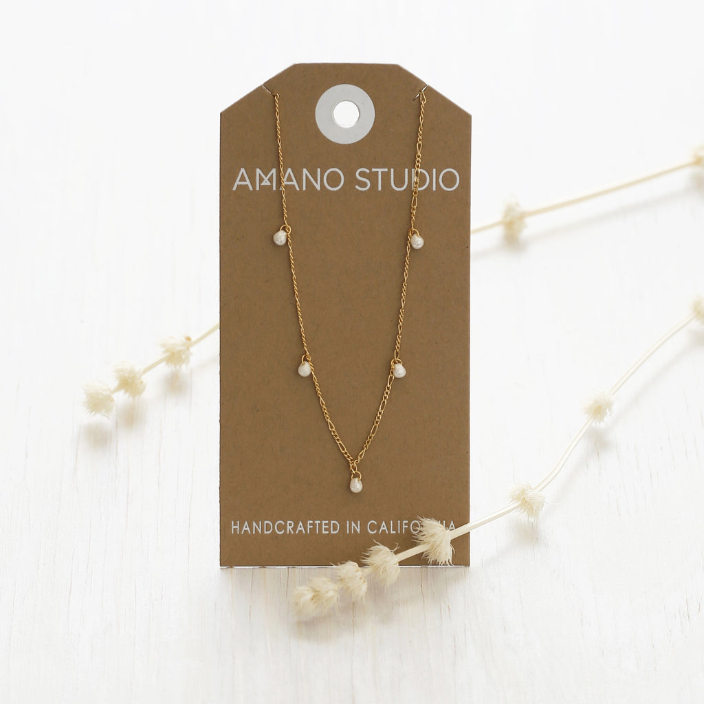 Five Graces Pearl Necklace packaging.