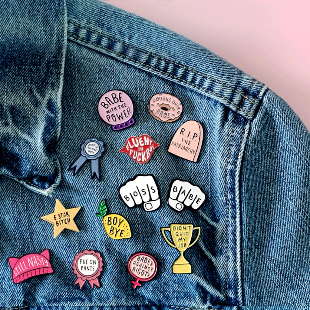 Fluent in Fboy Enamel Pin on jacket.