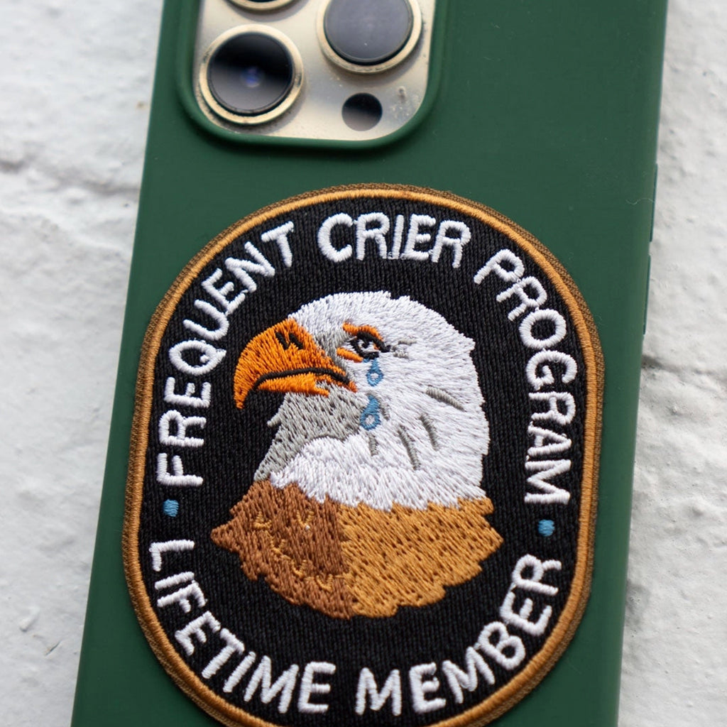 Frequent Crier Eagle Sticky Patch on back of phone.