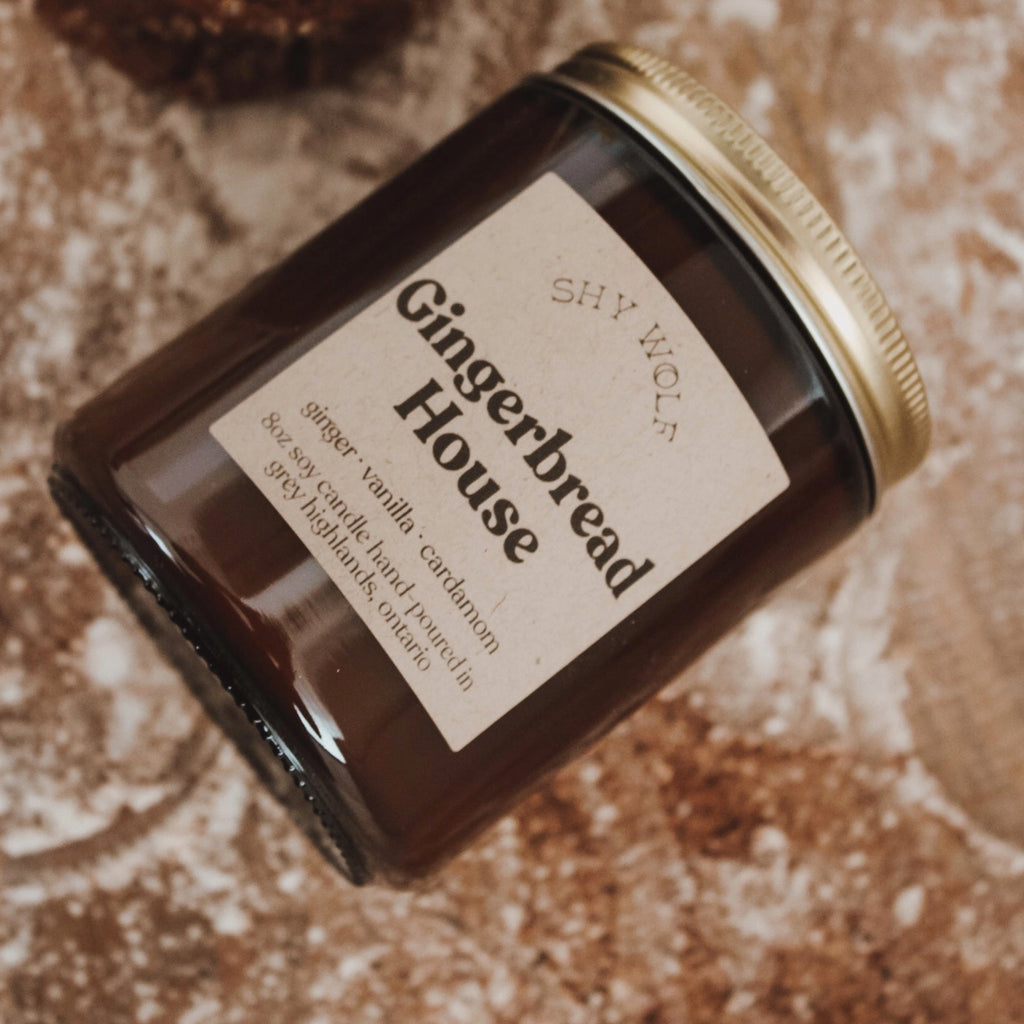 Gingerbread House Soy Candle on table.
