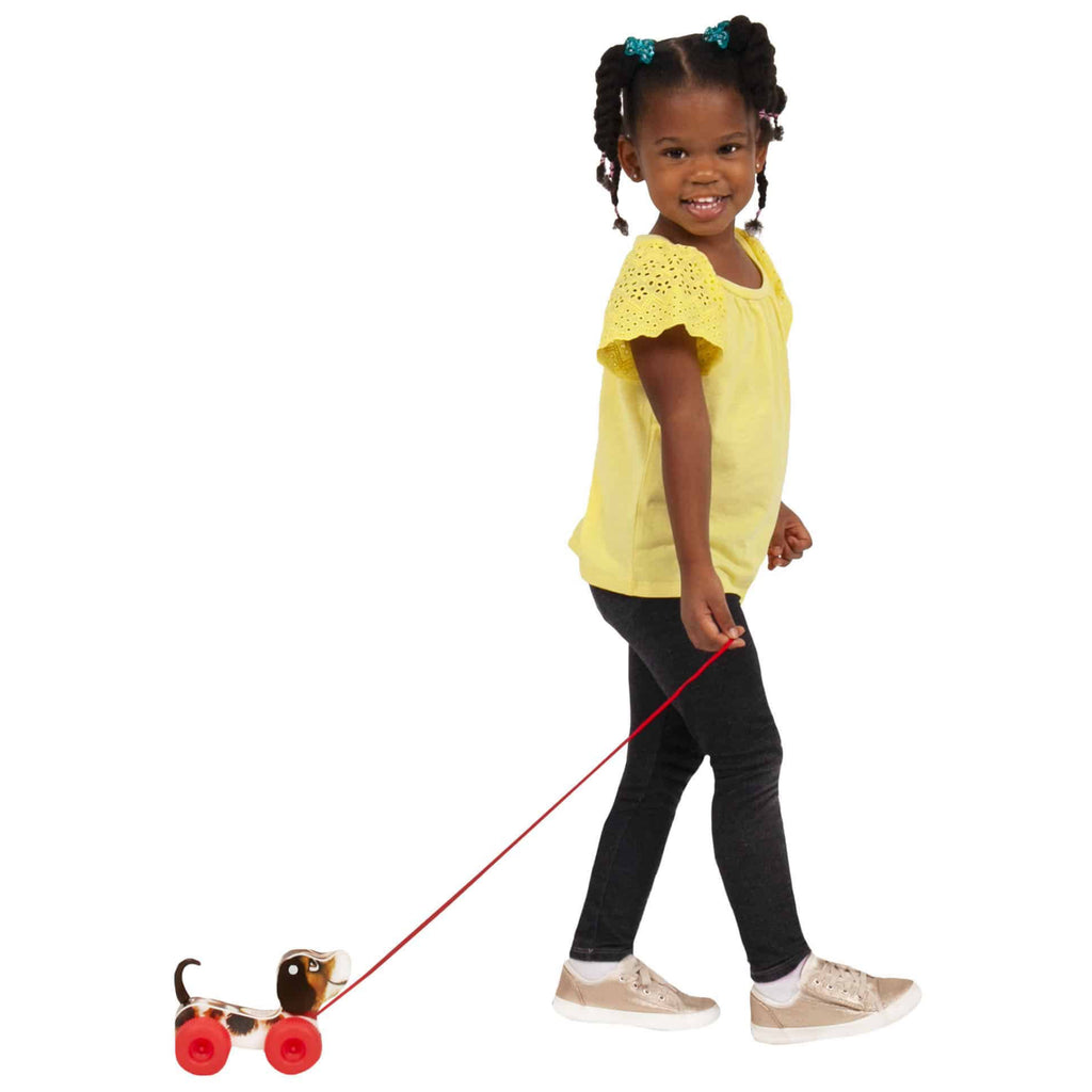 Girl playing with Fisher Price Little Snoopy .