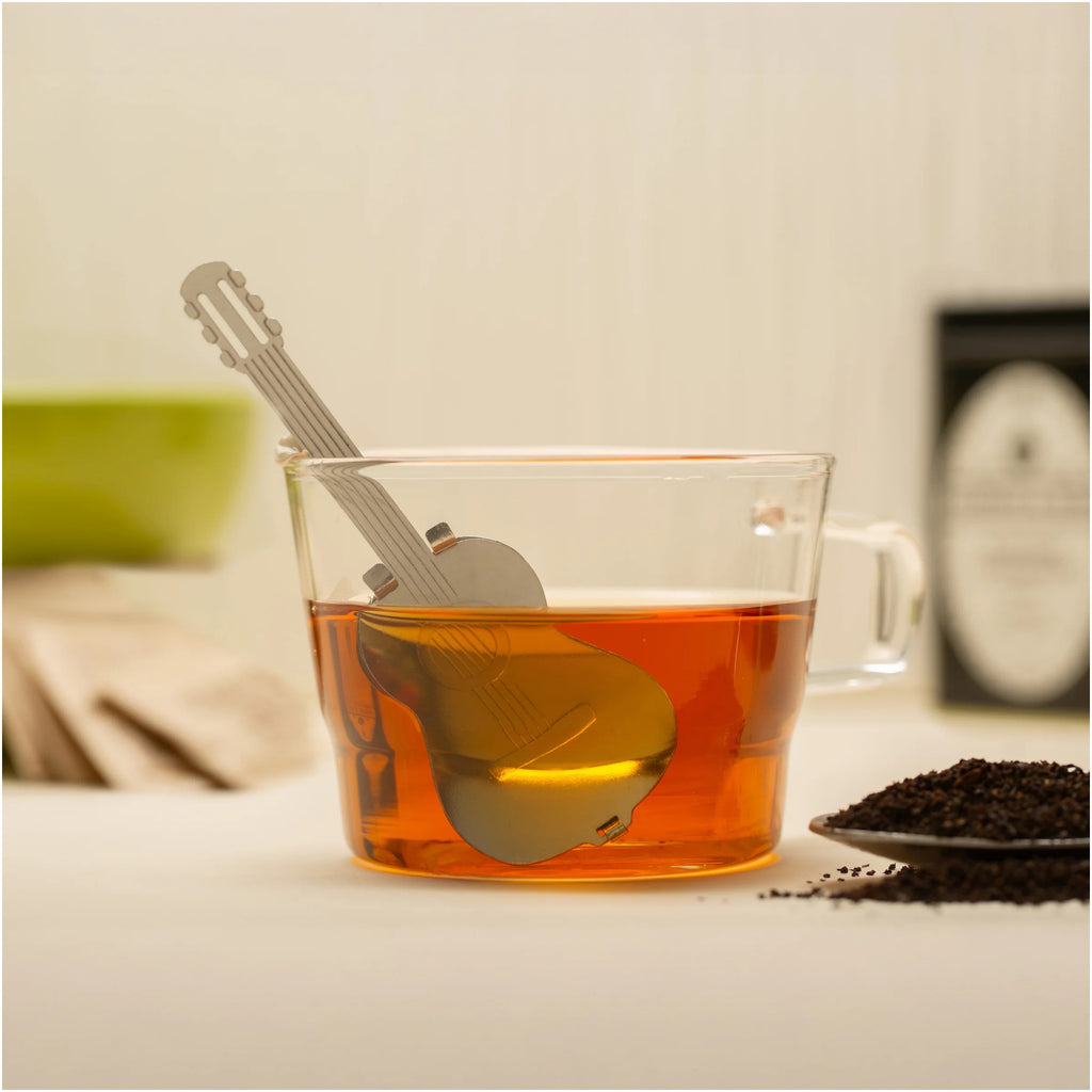 Guitar Tea Infuser on table.